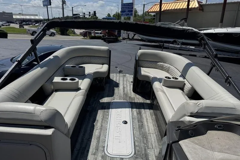 Slide: The Image of 2020 Crest Caribbean LX 250 SLC pontoon boat with spacious seating and cup holders. - 6