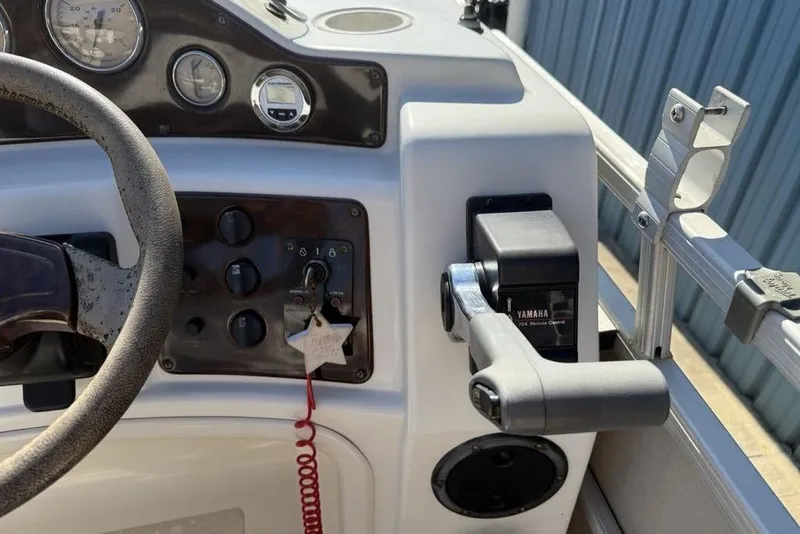 Slide: The Image of Control panel of a 2002 Godfrey AP220RS boat with Yamaha throttle. - 19