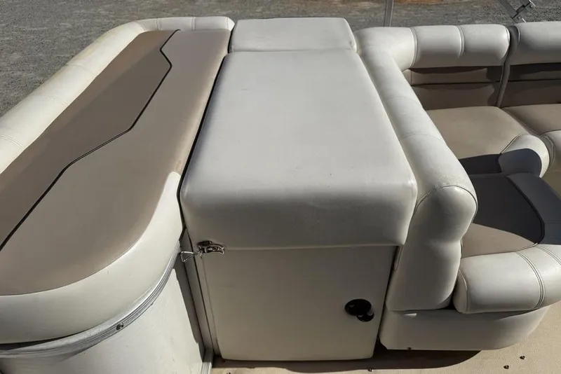 Slide: The Image of 2002 Godfrey AP220RS boat seating with beige and white upholstery. - 20