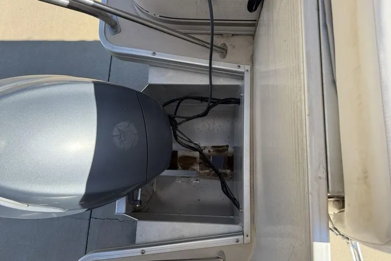 Slide: The Image of Top view of a 2002 Godfrey AP220RS boat engine compartment with visible wiring. - 22