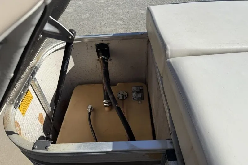 Slide: The Image of Open storage compartment in a 2002 Godfrey AP220RS boat. - 24