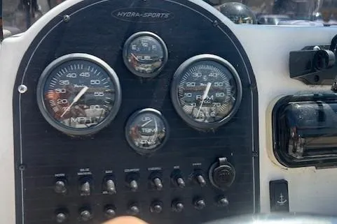Slide: The Image of Dashboard of a 2000 Hydra-Sports 175 boat with gauges and controls. - 4
