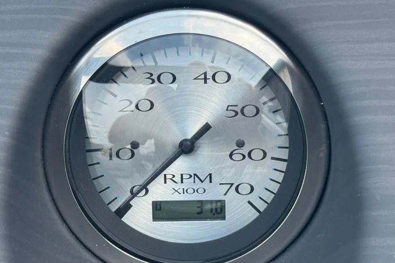 Slide: The Image of Close-up of a 2023 Bennington 20 SL RPM gauge displaying 3100 RPM. - 12
