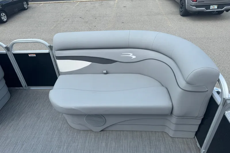Slide: The Image of 2023 Bennington 20 SL pontoon boat with gray seating and stylish design. - 16