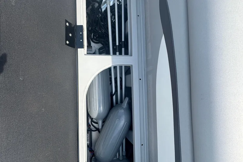 Slide: The Image of Storage compartment of 2023 Bennington 20 SL boat with fenders and equipment. - 23