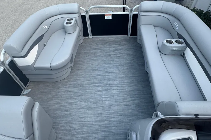 Slide: The Image of 2023 Bennington 20 SL pontoon boat interior with gray seating and cup holders. - 8
