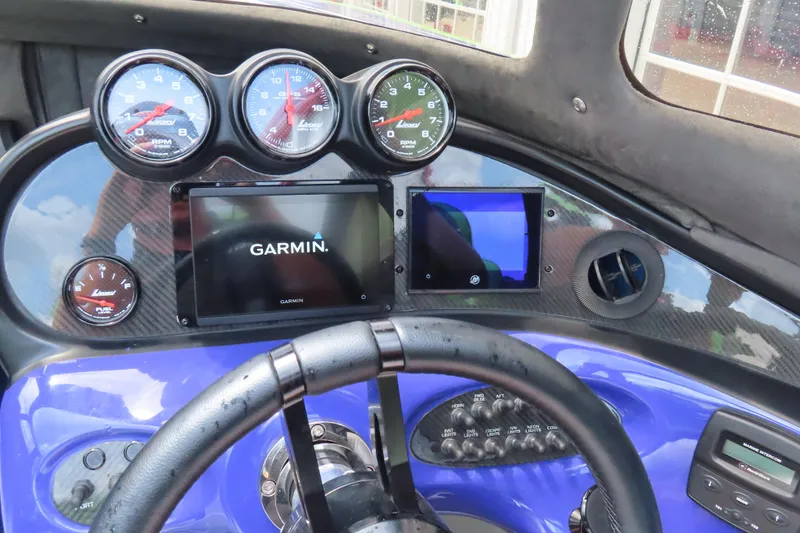 Slide: The Image of Dashboard of 2007 Outerlimits 44 GTX with Garmin navigation and performance gauges. - 24