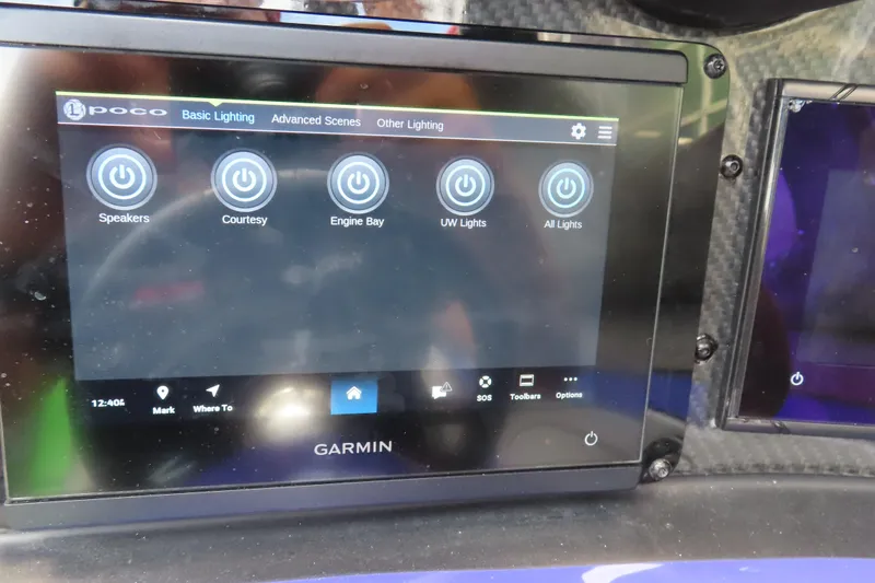 Slide: The Image of Garmin control panel on 2007 Outerlimits 44 GTX boat, displaying lighting options. - 29