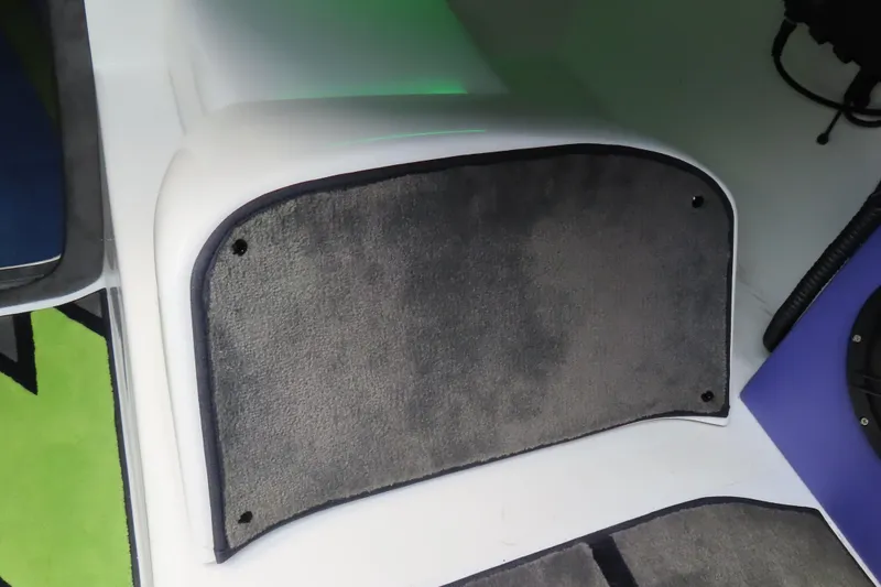 Slide: The Image of Interior detail of a 2007 Outerlimits 44 GTX boat, featuring a carpeted step. - 30