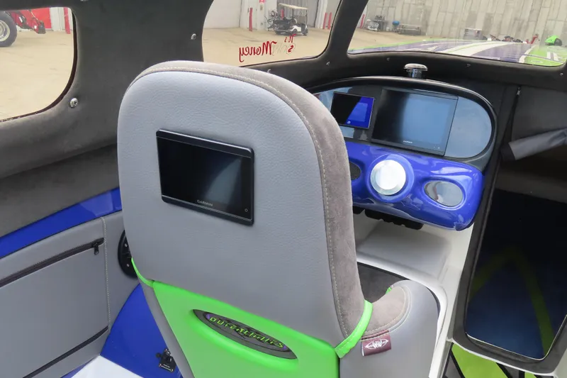 Slide: The Image of 2007 Outerlimits 44 GTX cockpit with modern navigation displays and sleek interior design. - 37