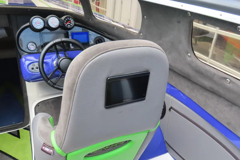 Slide: The Image of 2007 Outerlimits 44 GTX boat cockpit with steering wheel and instrument panel. - 38