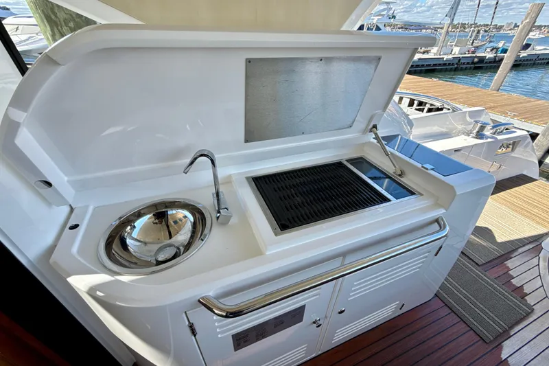 Slide: The Image of Outdoor kitchen on 2016 Sunseeker Predator 57 yacht with sink and grill. - 19