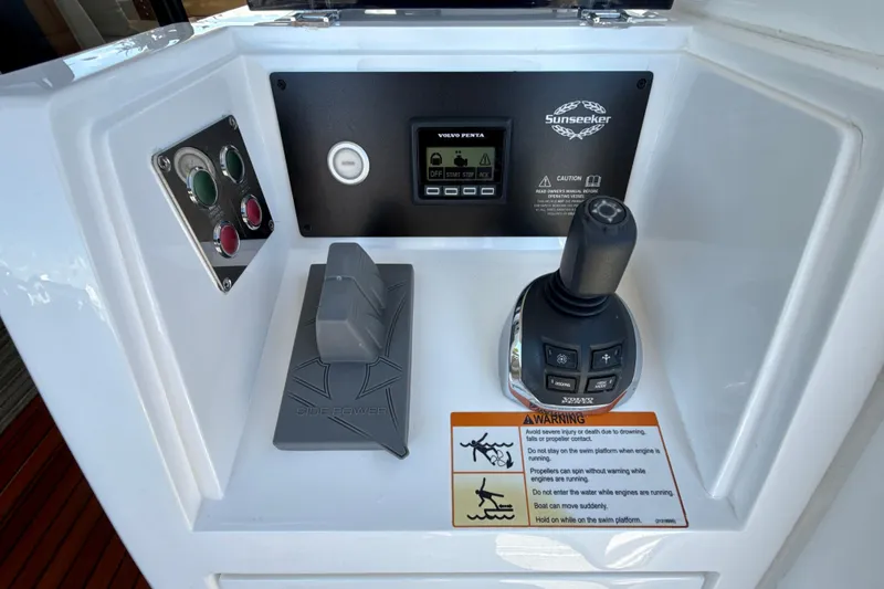 Slide: The Image of Control panel of a 2016 Sunseeker Predator 57 yacht with joystick and warning label. - 20
