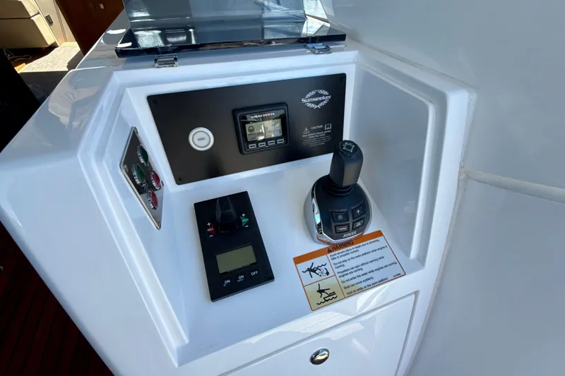 Slide: The Image of Control panel of a 2016 Sunseeker Predator 57 yacht with joystick and display. - 21