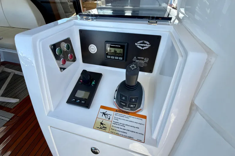 Slide: The Image of Control panel of 2016 Sunseeker Predator 57 yacht with joystick and warning labels. - 22
