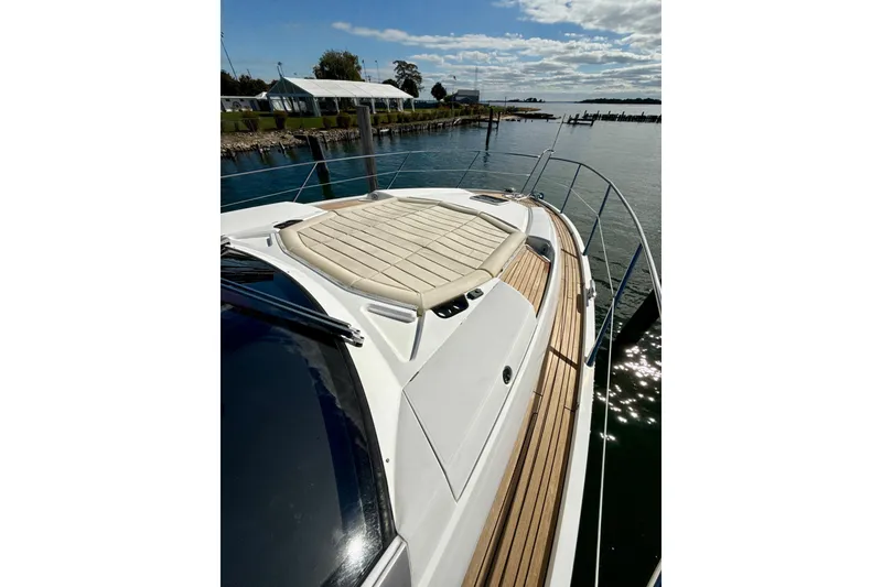 Slide: The Image of Sunseeker Predator 57 yacht, 2016 model, docked with sun pad and wooden deck. - 25