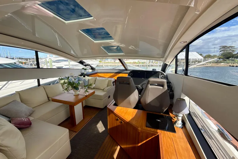 Slide: The Image of Luxurious interior of 2016 Sunseeker Predator 57 yacht with elegant seating and helm. - 27