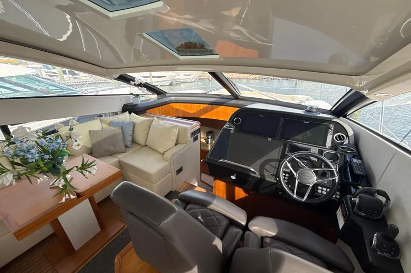 Slide: The Image of Luxurious interior of 2016 Sunseeker Predator 57 yacht with helm and seating area. - 34