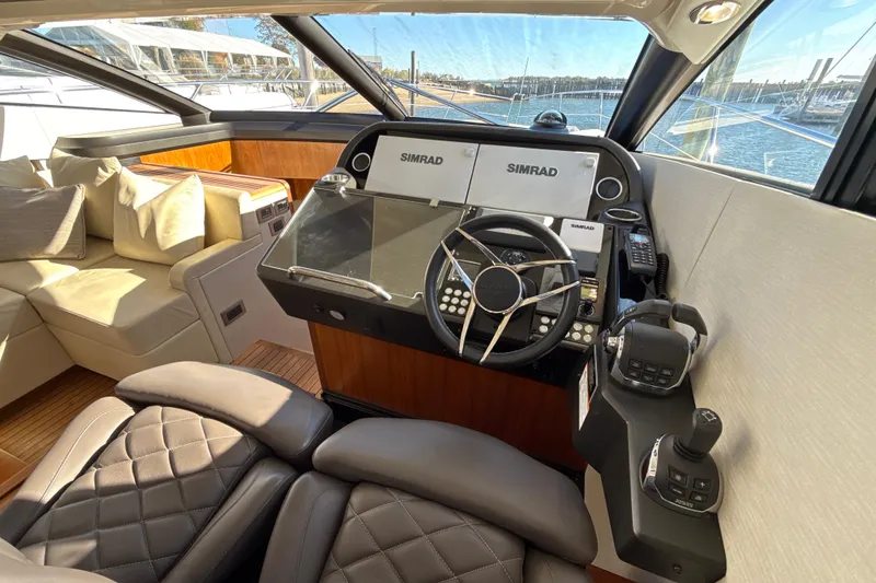 Slide: The Image of Luxurious helm of 2016 Sunseeker Predator 57 yacht with leather seating and advanced controls. - 35