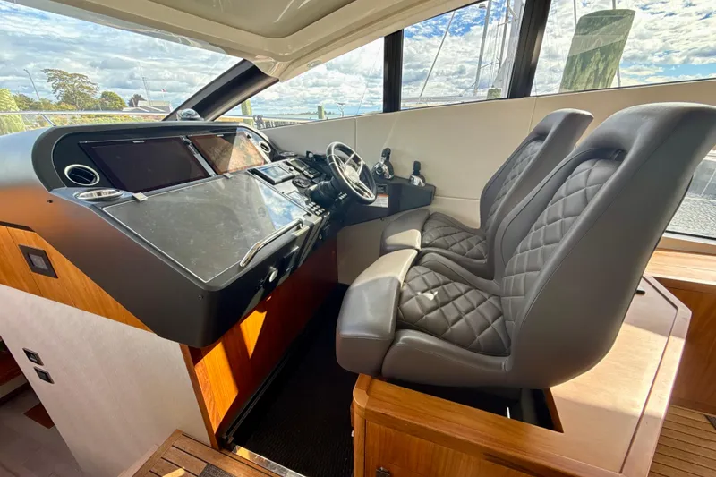 Slide: The Image of Interior helm of 2016 Sunseeker Predator 57 yacht with leather seats and modern controls. - 40