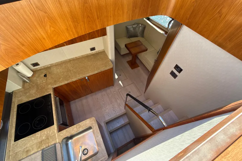 Slide: The Image of Luxurious interior of 2016 Sunseeker Predator 57 yacht with modern kitchen and seating area. - 46