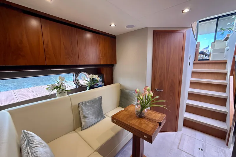 Slide: The Image of Luxurious interior of 2016 Sunseeker Predator 57 yacht with elegant seating and wooden accents. - 48