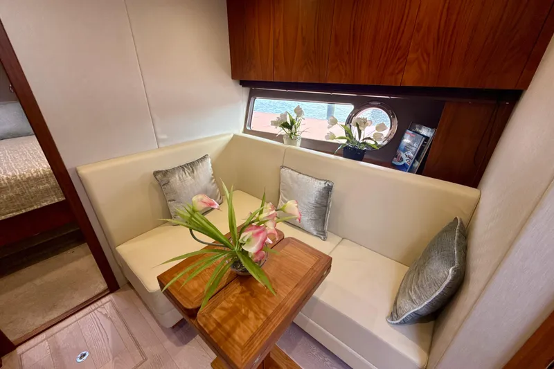 Slide: The Image of Luxurious interior of 2016 Sunseeker Predator 57 yacht with elegant seating and floral decor. - 49