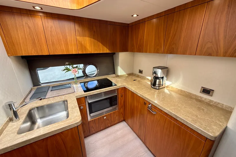 Slide: The Image of Luxurious kitchen interior of 2016 Sunseeker Predator 57 yacht with modern appliances. - 52