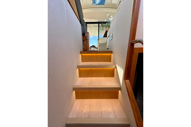 Slide: The Image of Staircase with ambient lighting inside 2016 Sunseeker Predator 57 yacht. - 54