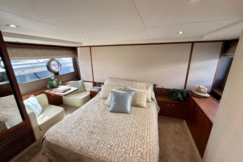Slide: The Image of Luxurious 2016 Sunseeker Predator 57 yacht bedroom with elegant decor and natural light. - 55