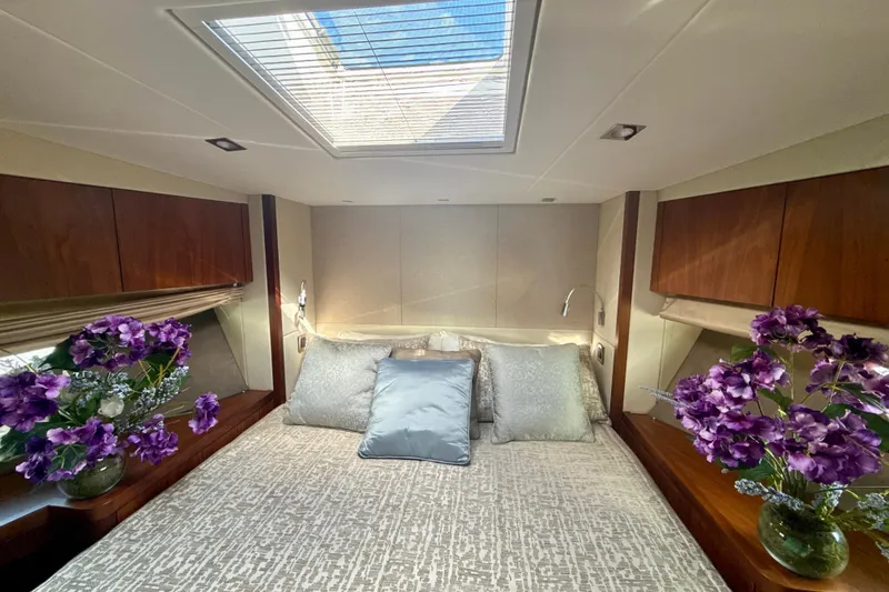 Slide: The Image of Luxurious Sunseeker Predator 57 yacht bedroom with skylight and elegant floral decor, 2016 model. - 61