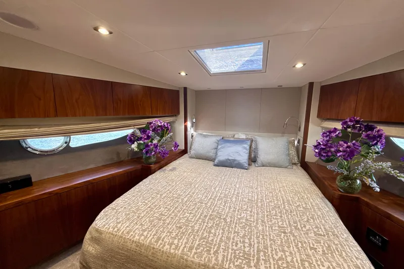Slide: The Image of Luxurious bedroom interior of 2016 Sunseeker Predator 57 yacht with elegant decor and floral accents. - 63