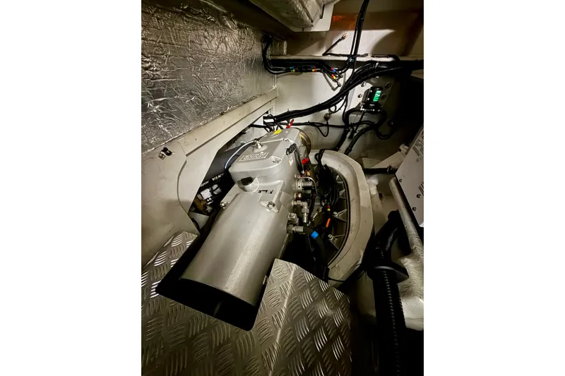 Slide: The Image of Engine room of 2016 Sunseeker Predator 57 yacht, showcasing mechanical components and wiring. - 72