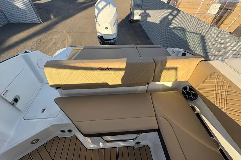 Slide: The Image of 2026 Sea Ray SDX 230 Outboard boat interior with tan seating and modern design. - 3