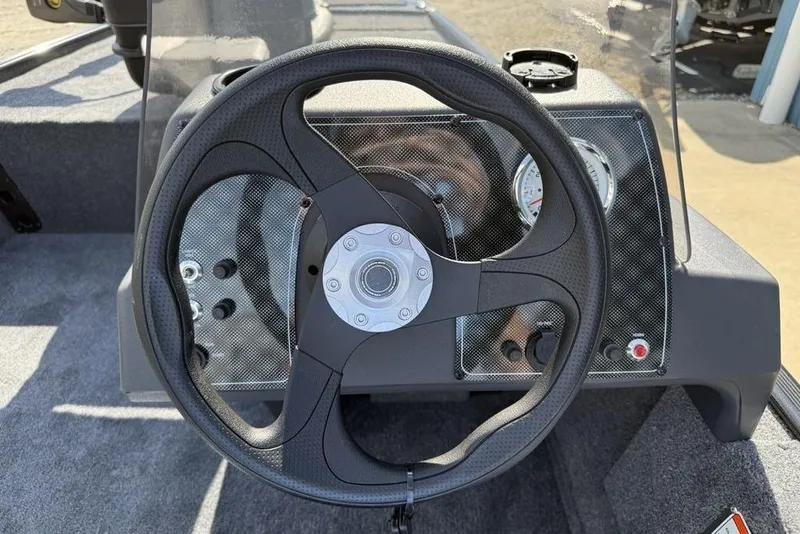 Slide: The Image of 2026 Tracker BASS TRACKER® Classic XL steering wheel and dashboard close-up. - 10