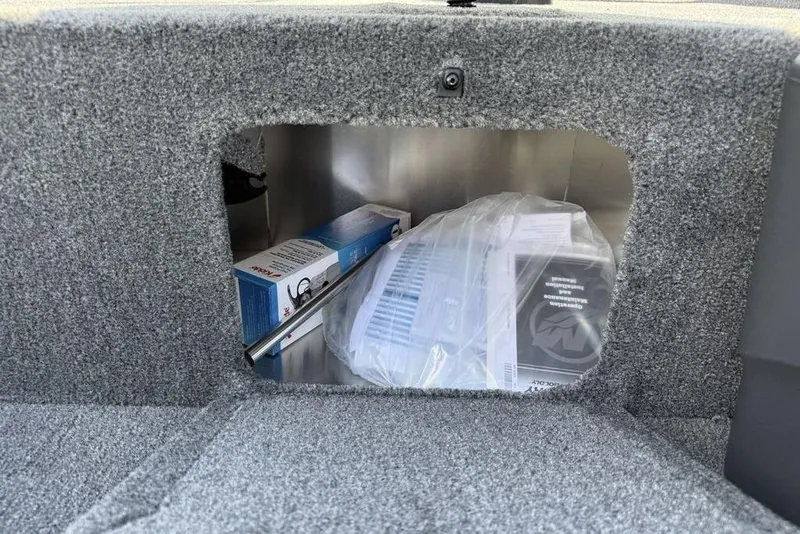 Slide: The Image of Storage compartment in 2026 Tracker BASS TRACKER® Classic XL boat with manuals and accessories. - 8