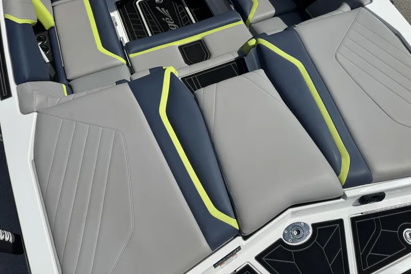Slide: The Image of 2020 Tigé 22RZX boat interior with gray and neon accents, featuring comfortable seating. - 11