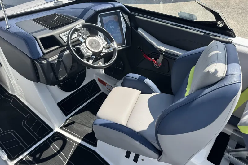 Slide: The Image of 2020 Tigé 22RZX boat cockpit with modern steering and comfortable seating. - 7
