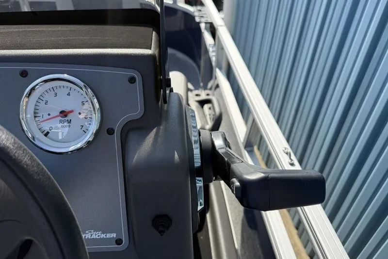 Slide: The Image of 2026 Sun Tracker Bass Buggy 16 XL Select dashboard with RPM gauge and throttle control. - 10