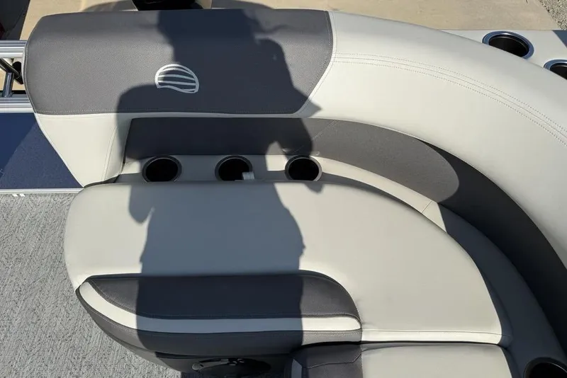 Slide: The Image of 2026 Sun Tracker Bass Buggy 16 XL Select boat seating with cup holders and shadow. - 12