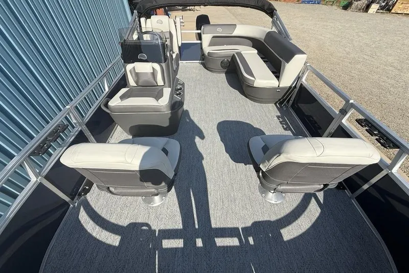 Slide: The Image of 2026 Sun Tracker Bass Buggy 16 XL Select pontoon boat interior with seating arrangement. - 19