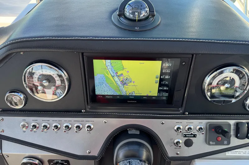 Slide: The Image of 2020 Four Winns Vista 275 dashboard with navigation system and controls. - 18