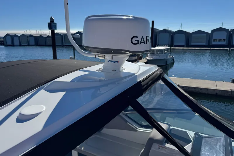 Slide: The Image of 2020 Four Winns Vista 275 boat with Garmin radar, docked at marina. - 21