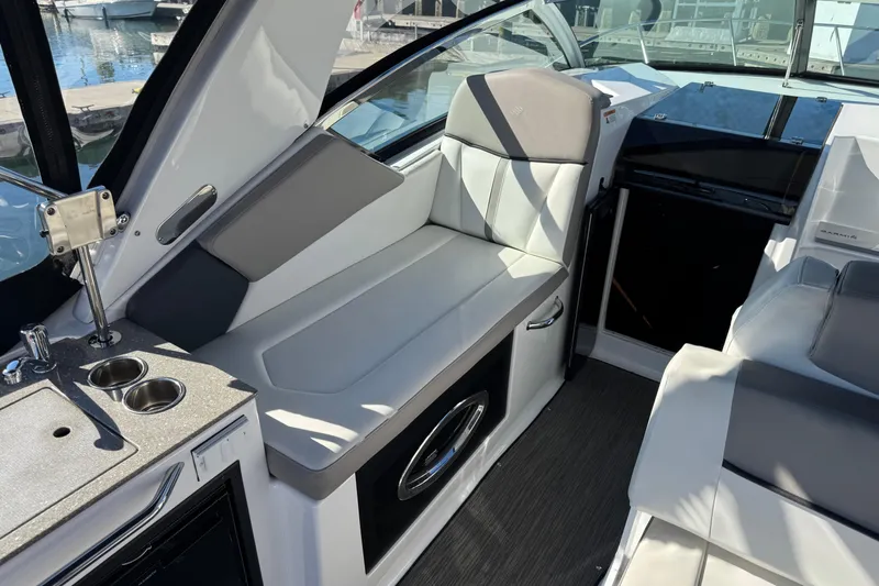 Slide: The Image of Interior of 2020 Four Winns Vista 275 boat with seating and kitchenette. - 9