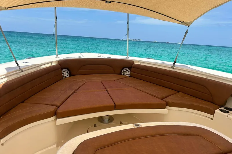 Slide: The Image of Luxurious 2019 Scout 420 LXF boat interior with brown seating, ocean view. - 32