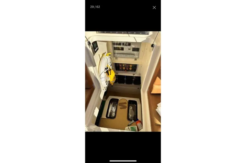 Slide: The Image of Interior view of 2019 Scout 420 LXF boat showing storage and equipment area. - 36