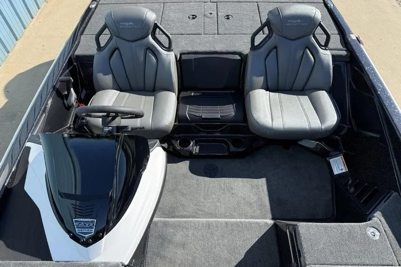 Slide: The Image of 2026 Skeeter ZXR20 SE boat interior with dual seats and steering console. - 15