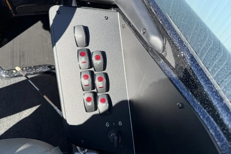 Slide: The Image of Control panel of 2026 Skeeter ZXR20 SE boat with labeled switches. - 18