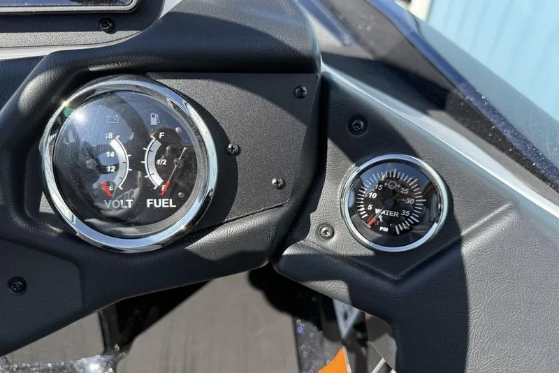 Slide: The Image of Dashboard of 2026 Skeeter ZXR20 SE showing volt, fuel, and water pressure gauges. - 19