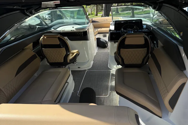 Slide: The Image of Luxurious interior of 2023 Sea Ray SLX 260 Outboard boat with tan leather seating. - 20